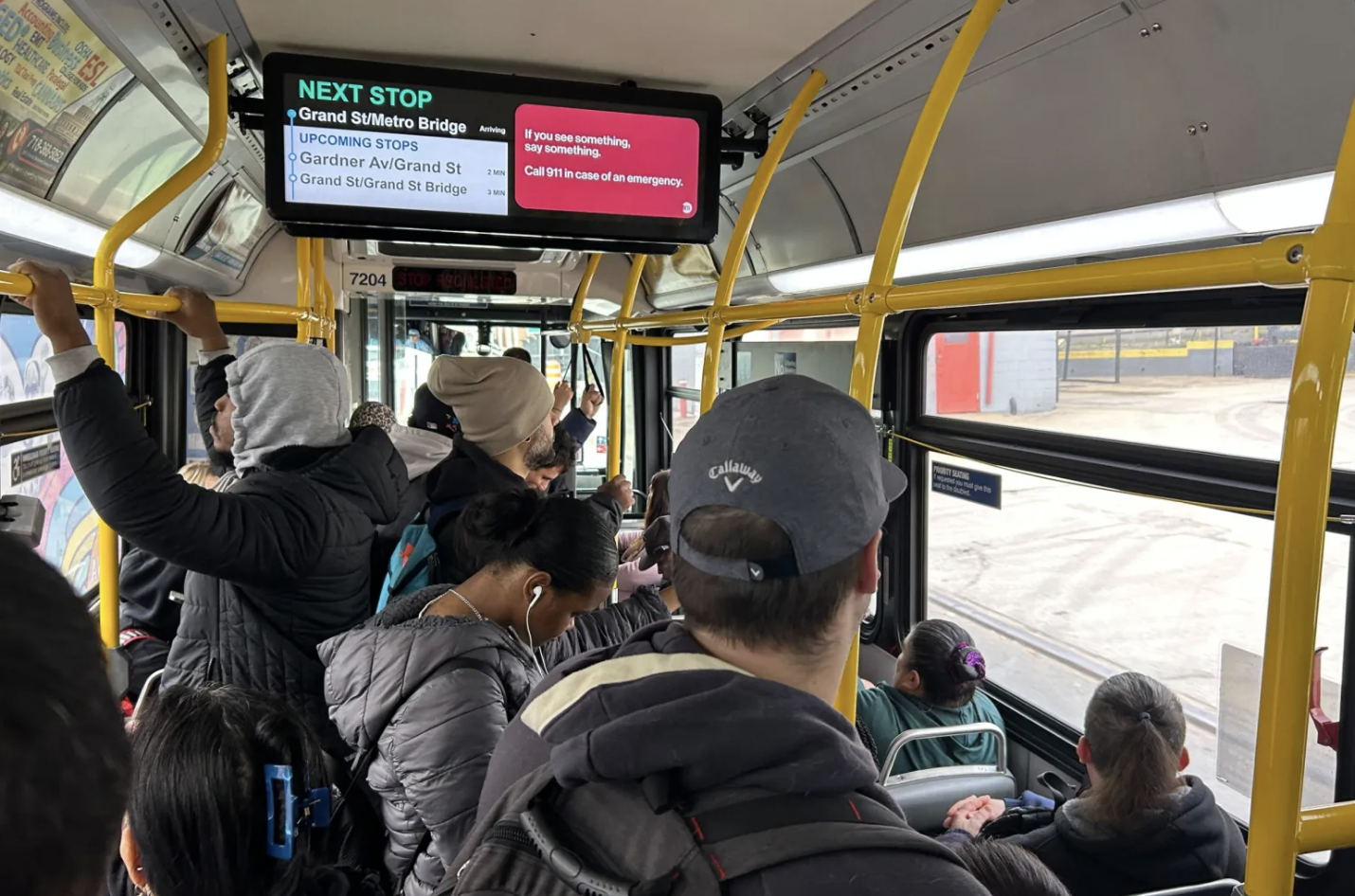 Commuters ride a Q59 bus from Greenpoint toward Queens